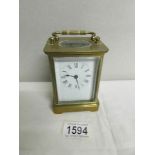 A good brass carriage clock in working order and with key.