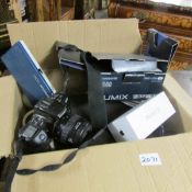 A box of camera's, iphone etc.
