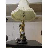 A bronze figural table lamp with shade,.