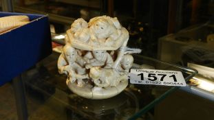 A 19th century carved and signed ivory netsuke depicting children at play.