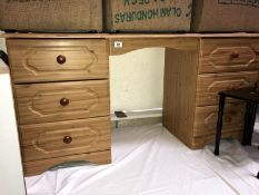 A pine effect kneehole dressing table