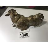 A hall marked silver fighting cock.
