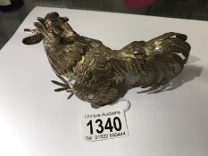 A hall marked silver fighting cock.