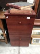 A dark brown 2 drawer filing cabinet