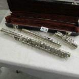 A cased flute marked Ramdone & Bazzoni, Milano.