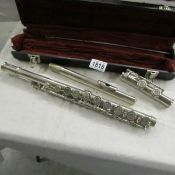 A cased flute marked Ramdone & Bazzoni, Milano.