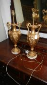 A pair of urn shaped table lamps.