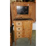 A bamboo cupboard having 4 small drawers and a single door.