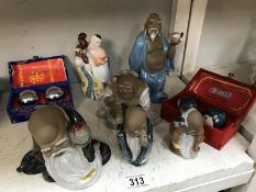 A quantity of oriental figurines & 2 sets of Chinese balls