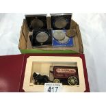 A small quantity of commemorative coins & a collectors van