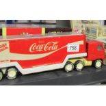 A 1:18 scale Carousel 1 Indianapolis 500 Roadster and a Buddy Coca Cola delivery wagon.