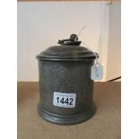 A pewter tea caddy.