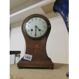 An oak inlaid mantel clock, springs ok.