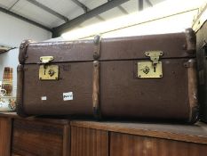 A brown travel case with beading