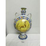 A large 2 handled flask shaped vase hand painted with animals, (possibly Delft).