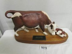 A Beswick Hereford cow and calf.