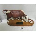 A Beswick Hereford cow and calf.