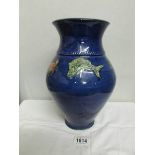 A Cornish studio pottery vase decorated with fish and crabs.