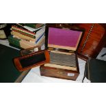 A walnut cased 'Swan's Stereoscopic Treasury' with viewer and cards.