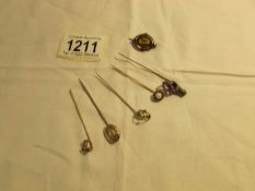 6 Victorian stick pins and a brooch.