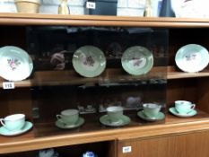 A gilt green & rose bone china partial tea set