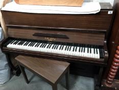 A Colona London piano and piano stool