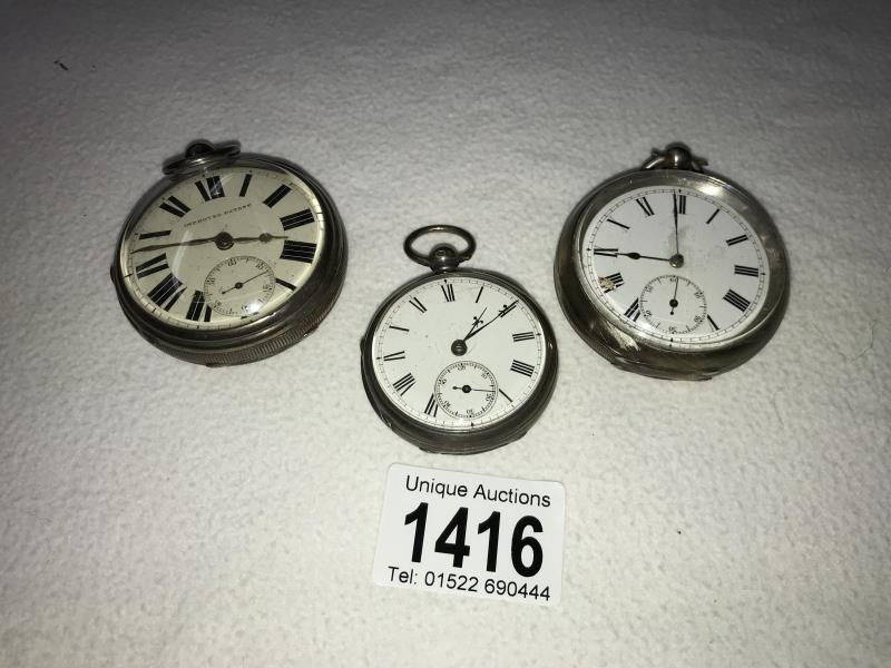 Three silver pocket watches.