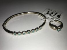 A silver/apatite bracelet and ring.