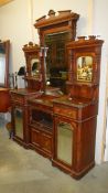 A mahogany mirror back sideboard with mirrors to doors.
