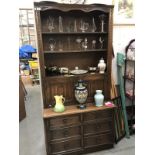 An oak linen fold carved dresser