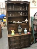 An oak linen fold carved dresser