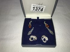 3 pairs of earrings in silver, one set amber, one set topaz and one worked filigree silver,.