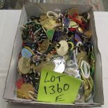 A collection of horse racing metal badges and other event badges from 1990s/2000s.