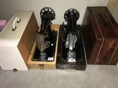 2 decorative Singer sewing machines in modern cases