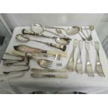 A good collection of silver plate cutlery including salad servers, fish servers, sporks etc.