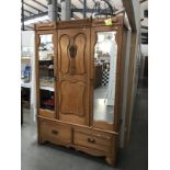 A satin walnut wardrobe with 2 door centre panel