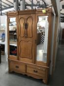 A satin walnut wardrobe with 2 door centre panel