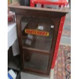 A collector's cabinet with Matchbox transfer to door.