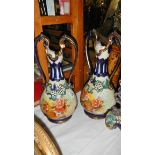 A pair of twin handled vases.