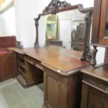 A Victorian mahogany double pedestal sideboard with mirror back.