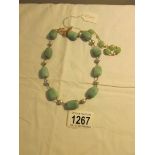 An Adventurine/pearl necklace from British Museum classical pieces.