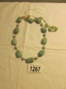 An Adventurine/pearl necklace from British Museum classical pieces.