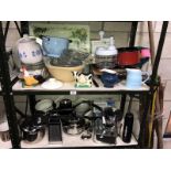 2 shelves of kitchenalia including glass measuring jug etc.