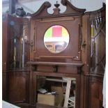 A magnificent mahogany fire surround with over mantle mirror and side cabinets.