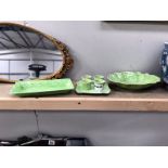 A set of green glazed items: egg cups on stand A/F,