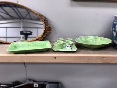 A set of green glazed items: egg cups on stand A/F,