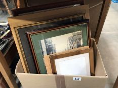 A box of framed and glazed pictures