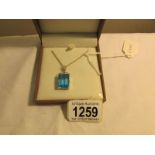 A sky blue topaz pendant set in silver.