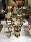 A collection of brass vases