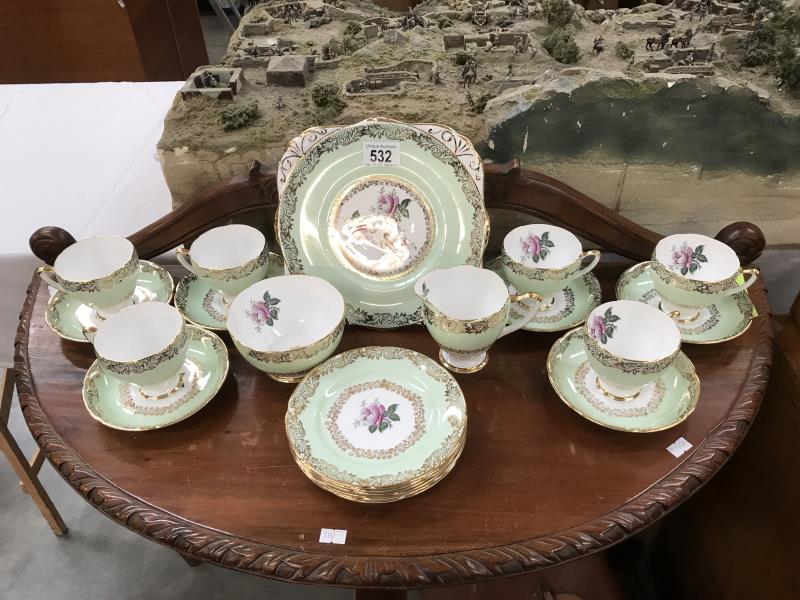 A part Dakin bone china tea set including 6 cups and saucers,